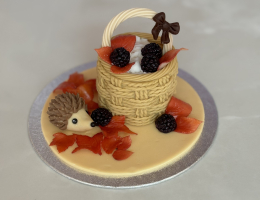 Autumn basket cake with mini modelled hedgehog